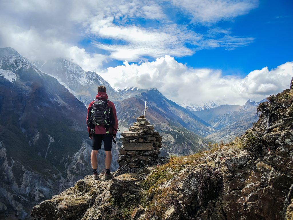 a travelller on a mountain